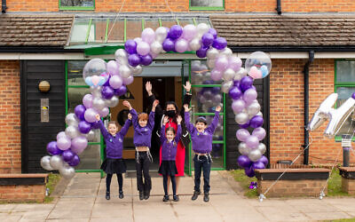 Pupils at Hertsmere Jewish Primary School in Radlett were welcomed back with a colourful balloon arch as students returned to the classroom for the first time in two months. Pictured are Year 1 students Ella Starkowitz, Zack Wolfisz, Sophie Hall and Ethan Goodman with headteacher Rita Alak-Levi. Credit: Claire Jonas Photography