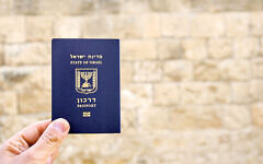 Holding the passport of the State of Israel Holding the passport of the State of Israel