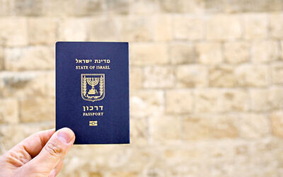 Holding the passport of the State of Israel
