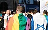 Keshet UK Pride picture from 2017, with a Jewish member of the march wearing a kippah, alongside another with an Israel flag. (Jewish News)