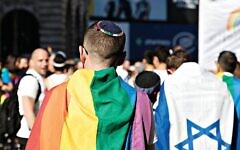 Keshet UK Pride picture from 2017, with a Jewish member of the march wearing a kippah, alongside another with an Israel flag. (Jewish News) Keshet UK Pride picture from 2017, with a Jewish member of the march wearing a kippah, alongside another with an Israel flag. (Jewish News)