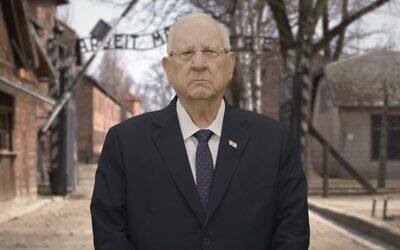 President Rivlin in front of the virtual Auschwitz gates