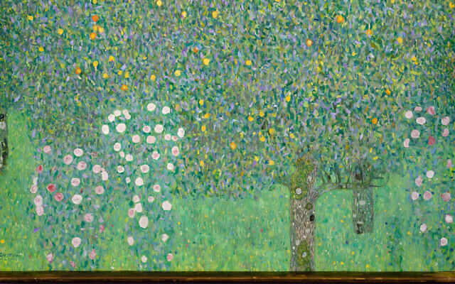 The painting "Rosebushes under the Trees" by Gustav Klimt hangs at the Musée d'Orsay museum in Paris, March 15, 2021. (Courtesy of the French Culture Ministry) via JTA