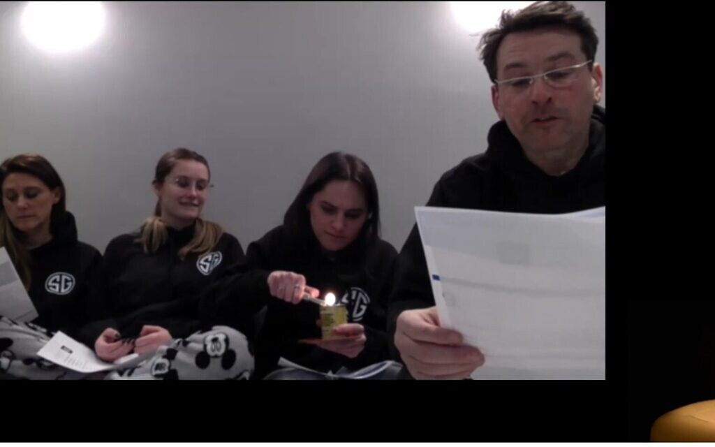 The Garcia Family lights their yellow candle