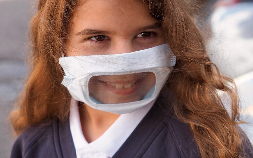 Student Lielle, in a clear face mask