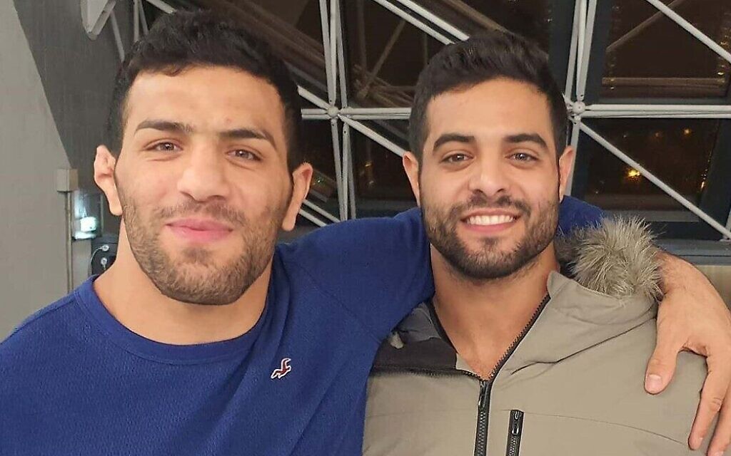 Israeli judoka Sagi Muki, right, and Iranian champion Saeid Mollaei embrace at the Paris Grand Slam, February 10, 2020, in an Instagram photo posted online by Muki. (Instagram screen capture via Times of Israel)