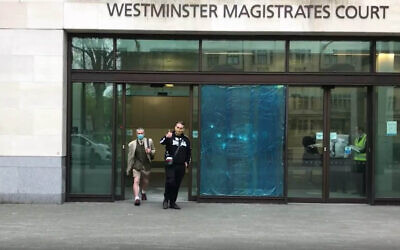 Ben Raymond (right), 31, leaving Wesminster Magistrates' Court, London where he faced four charges, including membership of a proscribed organisation contrary to Section 11 of the Terrorism Act between December 17 2016 and September 27 2017, and three counts of possessing material likely to be useful for terrorism under Section 58 of the act. Raymond did not indicate pleas to any of the charges.