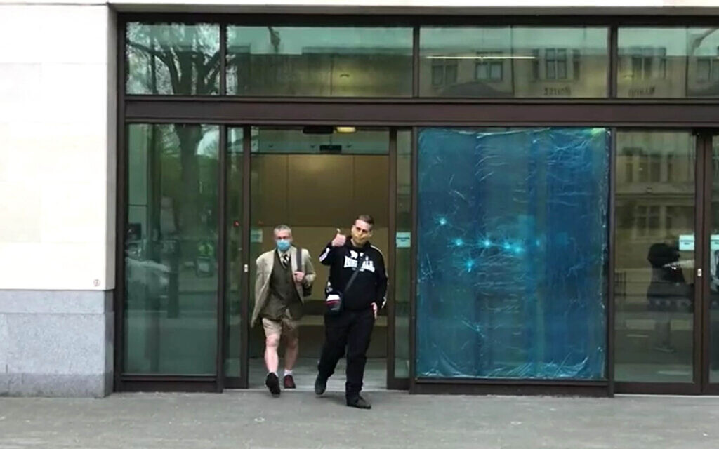 Screen grab of Ben Raymond (right), 31, leaving Wesminster Magistrates' Court, London where he faced four charges, including membership of a proscribed organisation contrary to Section 11 of the Terrorism Act between December 17 2016 and September 27 2017, and three counts of possessing material likely to be useful for terrorism under Section 58 of the act. Raymond did not indicate pleas to any of the charges.