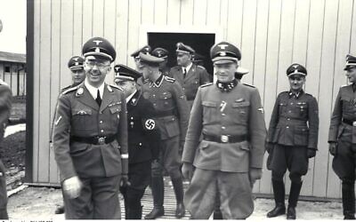 Franz Josef Huber (in doorway) with Heinrich Himmler, August Eigruber and other SS officers, at Mauthausen-Gusen concentration camp, June 1941. (Wikipedia/ Attribution: Bundesarchiv, Bild 192-352 / CC-BY-SA 3.0 - https://creativecommons.org/licenses/by-sa/3.0/de/legalcode)