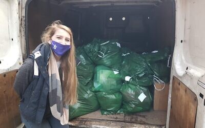 Hannah Gerson from US Chesed with bags of the essential packs ready to be sent out to asylum seeker families.