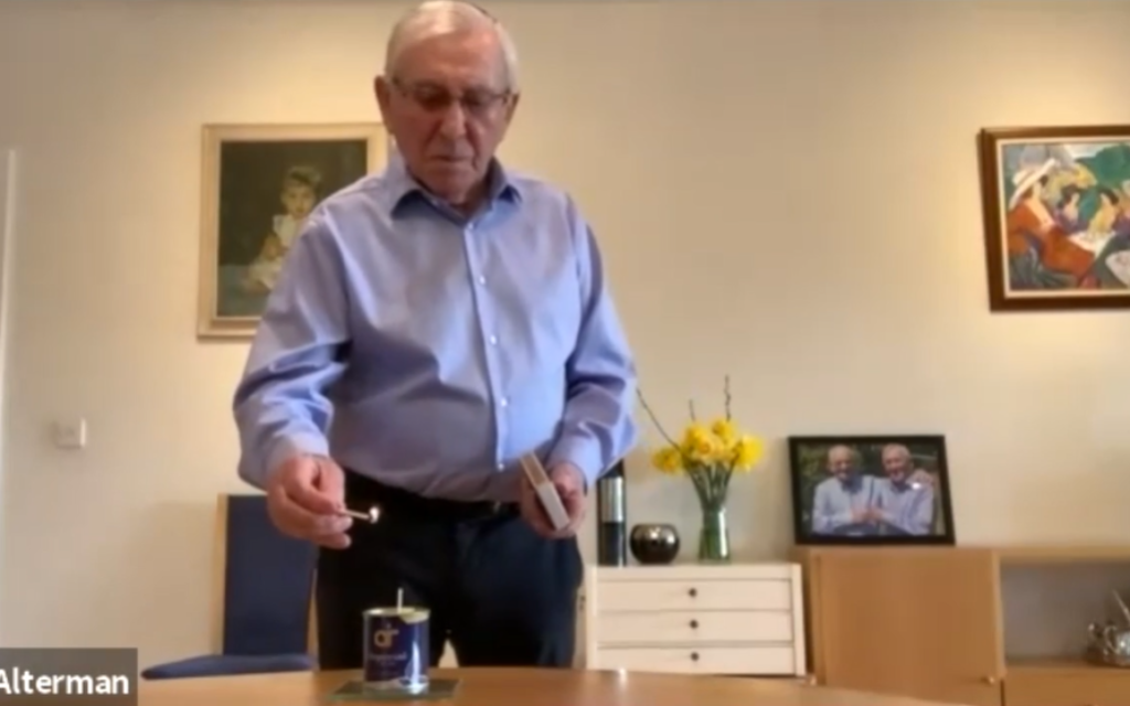 Ike Alterman lighting a candle for Yom HaShoah