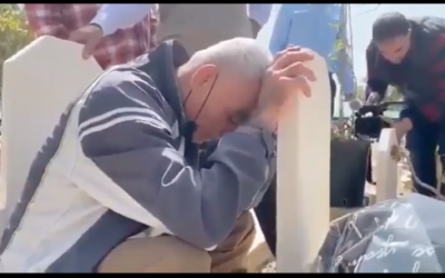 Rushdi Abu Mokh praying at the grave of his mother who died two years before his release, last week. (Screenshot from Twitter via Jewish News.)