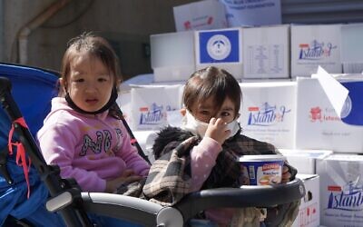Young Uyghur children in Istanbul collecting food parcels (Photo: WJR)