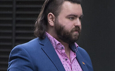 Andrew Dymock outside the Old Bailey, London, where he appeared on 15 charges relating to right-wing extremism. Dymock, 23, from Bath, is alleged to have promoted the extreme-right System Resistance Network (SRN) group through his Twitter account and website. Picture date: Thursday May 6, 2021.