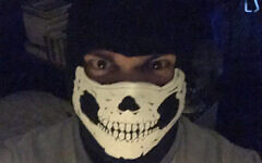 Handout photo issued by Counter Terrorism Policing North East of an image of a person wearing a skull mask which was sent via an electronic device used by Andrew Dymock, and which has been exhibited in his right-wing extremism trial at the Old Bailey in London. Dymock, 23, from Bath, is alleged to have promoted the extreme-right System Resistance Network (SRN) group through his Twitter account and website.