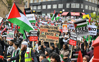 Demonstrators walk through Kensington as they make their way to the Israeli embassy in London, during a march in solidarity with the people of Palestine.