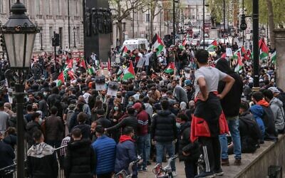 Palestinians in London gathered next to Downing Street to rally against a law discussed in the Knesset  on whether Jewish settlers can evict Palestinians by force from their homes. (Paul Quezada-Neiman/Alamy Live News)