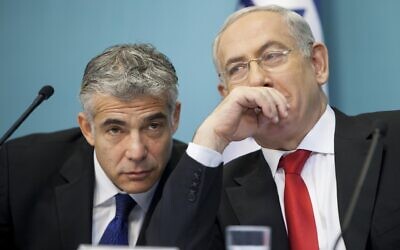 Benjamin Netanyahu (R) is seen next to  Yair Lapid ( © Omer Messinger/ZUMA Wire/Alamy Live News)