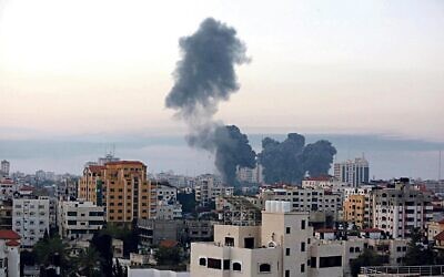 Smoke rise after an Israeli airstrike in Gaza City