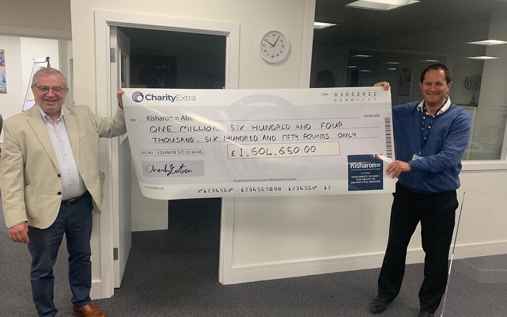 Kisharon Chairman Philip Goldberg and Kisharon Chief Executive Richard Franklin holding the Charity Extra cheque