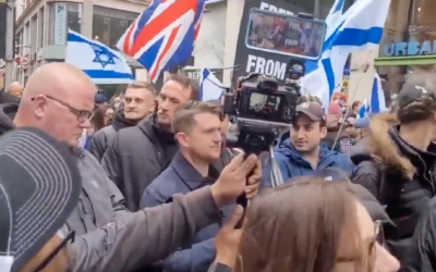 Tommy Robinson pictured crashing a pro-Israel rally in London