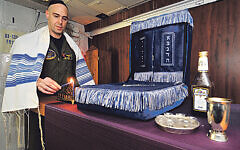 Jewish lay leader of the Nimitz-class aircraft carrier USS Harry S. Truman (CVN 75), lights a candle celebrating the 1st night of Hanukah in the ship's chapel.   (U.S. Navy photo by Mass Communication Specialist 2nd Class Kilho Park/Released)