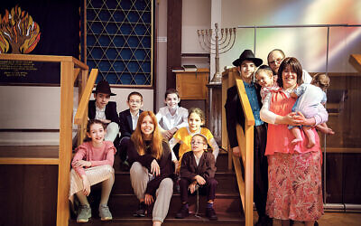 Stacey Dooley pictured with Rabbi Mordechai Wollenberg  and his wife Blima, and their nine children, for her new series, Stacey Dooley Sleeps Over
