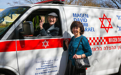 Norman and his wife Eve Rosenbaum with the latest MDA ambulance (Yakir Zur)