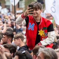 Protester wearing yellow stars during the 'Unite for Freedom' anti-lockdown and anti-vaccines protest during final stage of the national lockdown. Credit: Mario Mitsis/WENN