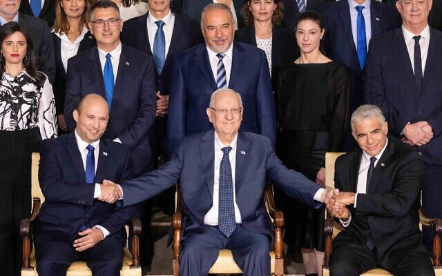 The new Israeli Prime Minister Naftali Bennett (L), Israeli President Reuven Rivlin (C) , and Alternate Prime Minister and Minister of Foreign Affairs Yair Lapid (R), during a joint photo with the new government ministers at the President's residence in Jerusalem, Israel, 14 June 2021. The Knesset members on 13 June 2021 voted for the eight-party alliance led by Bennett from the far-right Jamina and Jair Lapid from the Future Party, the Knesset vote ends the historic 12-year rule of Prime Minister Benjamin Netanyahu. Photo by: JINIPIX