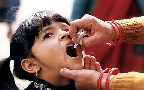 "Girl receiving oral polio vaccine" by CDC Global Health is licensed under CC BY 2.0