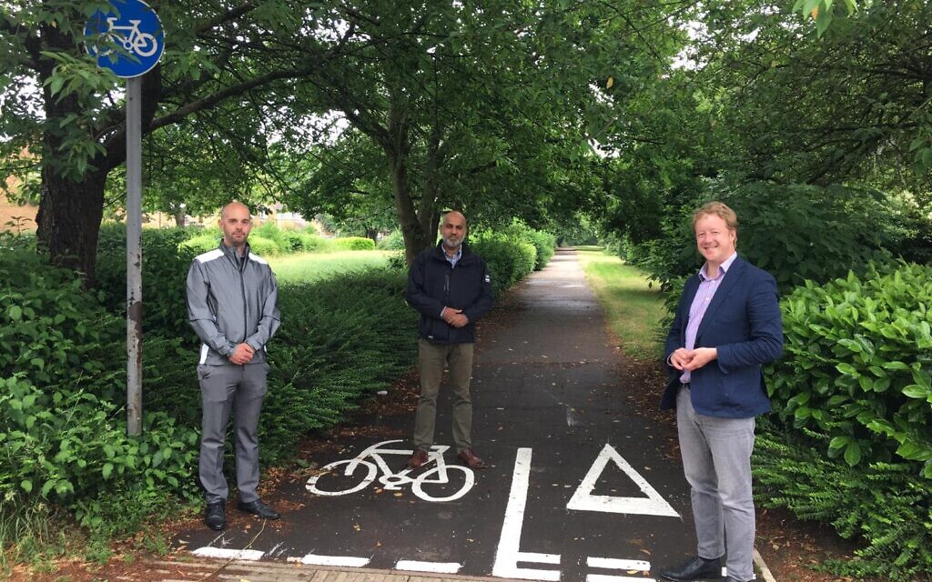 Ishfaq Hussain (centre) with Paul Bristow, campaigning (right)