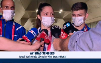 Avishag Semberg speaking to the press after winning a bronze medal (Screenshot from i24 News.)