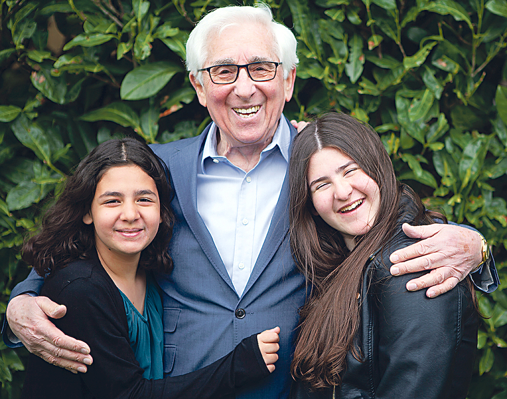 Saul Erner, 86, with his granddaughters. He came to the UK with his mother and sisters aged five when the Germans invaded Belgium. His father was killed by the Gestapo. Credit: Sian Bonnell