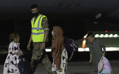 IMAGE BLURRED AT SOURCE Ministry of Defence handout photo of passengers disembarking a Royal Air Force Voyager after arriving at RAF Brize Norton from the Middle East. Boris Johnson and other G7 leaders have failed to persuade the US to keep troops in Afghanistan to continue evacuation efforts past the end of the month. Picture date: Tuesday August 24, 2021.