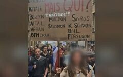 A woman holds up a placard denouncing President Emmanuel Macron and several prominent Jews denounced as traitors at a protest against COVID restrictions in Metz, France on Aug. 7, 2021. (Gérald Darmanin/Twitter) via JTA A woman holds up a placard denouncing President Emmanuel Macron and several prominent Jews denounced as traitors at a protest against COVID restrictions in Metz, France on Aug. 7, 2021. (Gérald Darmanin/Twitter) via JTA