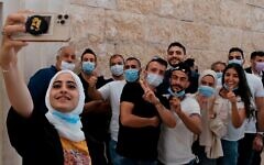 Palestinian residents of Sheikh Jarrah take a selfie on Monday before attending a petition regarding evacuation from their home in Sheikh Jarrah neighborhood, at the Supreme Court Palestinian residents of Sheikh Jarrah take a selfie on Monday before attending a petition regarding evacuation from their home in Sheikh Jarrah neighborhood, at the Supreme Court