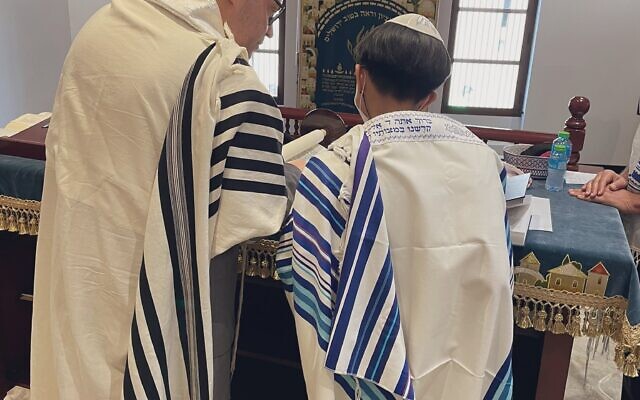The bar mitzvah boy, who was not named, read from a Torah scroll commissioned by Jared Kushner (Photo: Association of Gulf Jewish Communities)