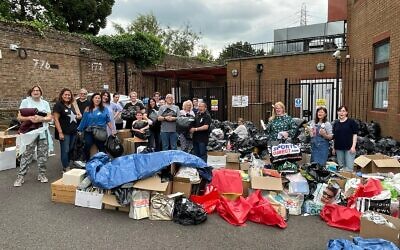 Volunteers with bags of donated items at Bushey synagogue