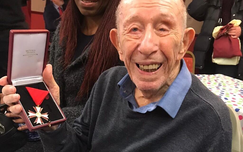 Eric Sanders holding the Austrian Cross of Honour for Culture and Science