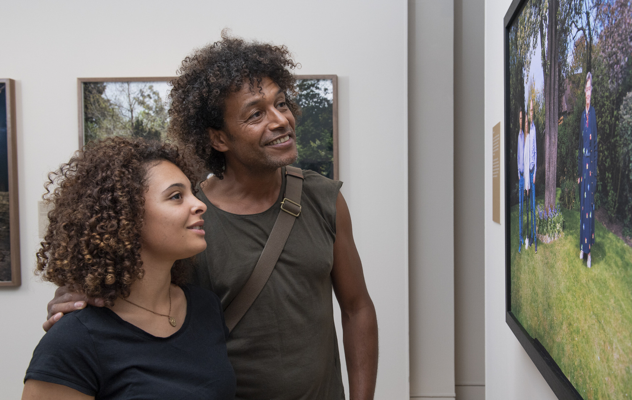 © IWM (0882)
Visitors explore Generations: Portraits of Holocaust Survivors at IWM London.