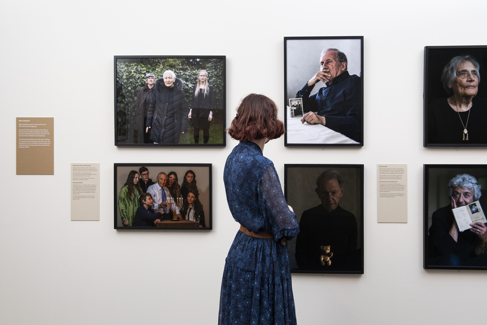 © IWM (1048)
A visitor looks at portraits taken by Jillian Edelstein for Generations: Portraits of Holocaust Survivors at IWM London.