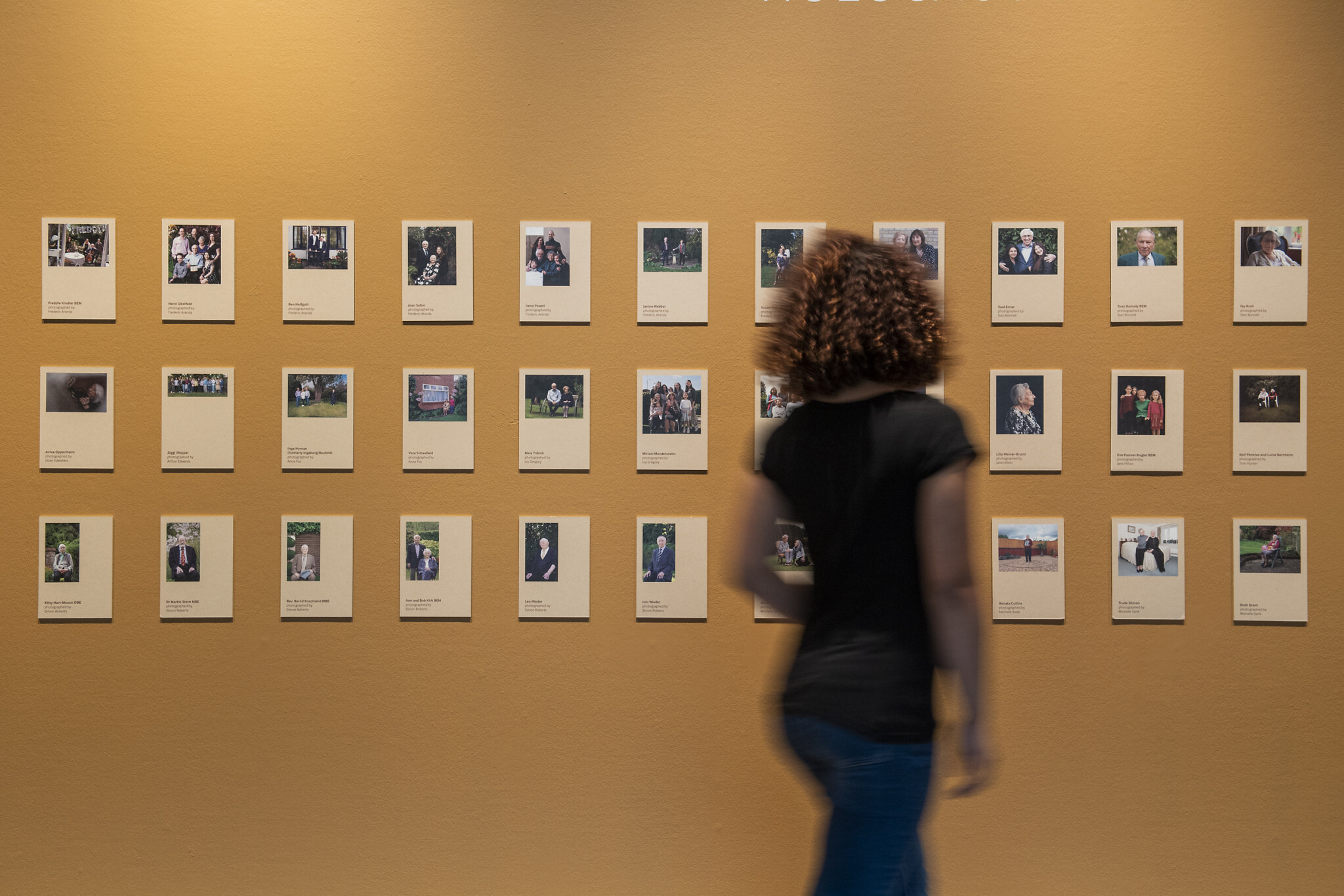 © IWM (1571)
A visitor explores Generations: Portraits of Holocaust Survivors at IWM London.