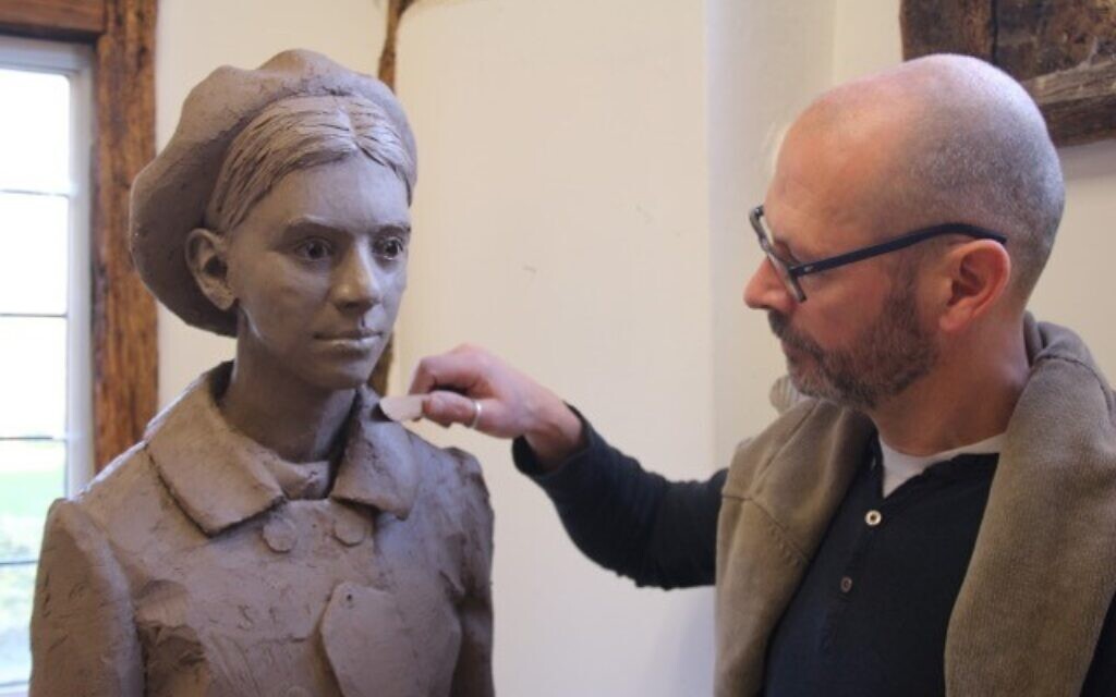 Artist Ian Wolter with a figure for the Kindertransport Memorial 'Safe Haven' in Harwich