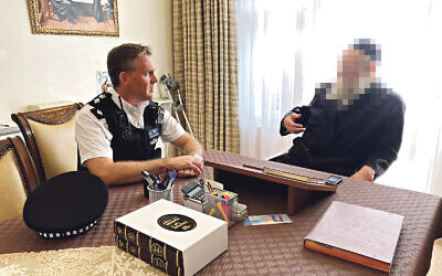 Jacob Lipchitz in his home with 
MPS Hackney  Chief Supt Barnett, and members of Shomrim