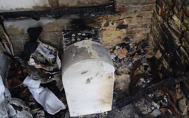 Illustrative: The grave of a daughter of Rabbi Nachman of Bratslav after it was torched in Kremenchuk, Ukraine, in 2015. (Oholei Tzadikim via JTA)