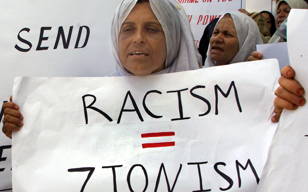 A Palestinian woman carries a banner during a demonstration in the Gaza Strip on September 5, 2001, ahead of the UN conference in Durban, South Africa (Photo: Reuters/Ahmed
Jadallah)