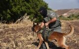 An Israel Border Police dog handler with his dog during the search (Wikipedia/Israel Police/(CC BY-SA 3.0))