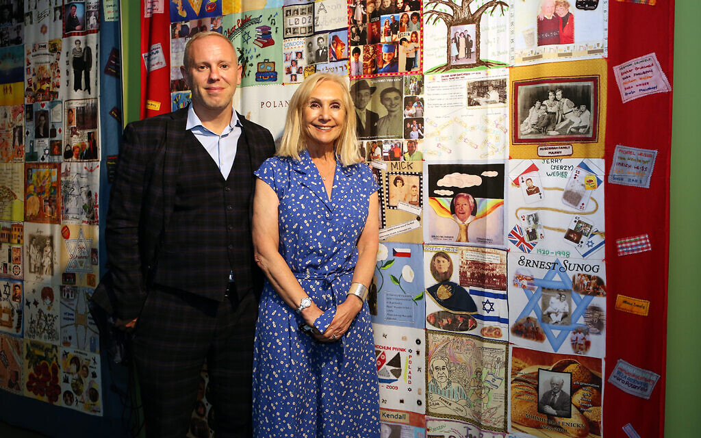 Rob Rinder MBE and Angela Cohen MBE (Chairman of the '45 Aid Society) next to the '45 Aid Society Memory Quilts at the Loughton Boys exhibition at Epping Forest District Museum on Sunday 5th September (credit: Melissa Page)