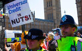 Universal Credit protestors march to the Houses of Parliament with the slogan Universal Credit is nuts Credit: Tim Ring/Alamy Live News